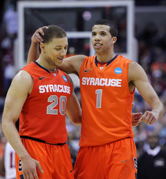 Brandon Triche #20 of the Syracuse Orange puts the ball up to the basket against Montana.