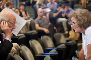 (From left) Samuel Gorovitz, professor of philosophy, and Teresa Gilman, University Senate recorder, talk at the first USen meeting, which lasted less than 10 minutes.