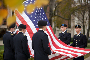 Members of the ROTC hold the flag during Monday's Veteran's Day Ceremony honoring the more than 6,000 who have lost their lives in the war on terror.