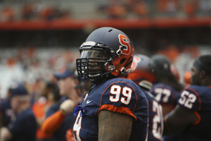 Syracuse unveiled new, two-toned helmets last season, worn here by defensive tackle Ryan Sloan.