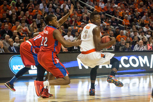 Jerami Grant spins into the lane against Dayton in the third round of the NCAA Tournament. Grant has yet to announce his decision on whether or not he will leave Syracuse for the NBA.