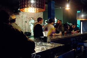 Customers sip a drink as they listen to live music at the new Funk 'n Waffles in Armory Square. The new location includes a full bar, daily live music and the same menu as the SU location. The new location boasts a new 21 and over version of the original location. 