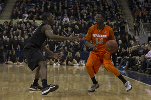 Kaleb Joseph scans the floor from the perimeter during the Orange's 83-77 loss to Pittsburgh on Saturday.