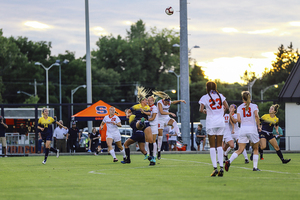 Syracuse drops into a 4-5-1 without the ball, packing five players into the midfield.