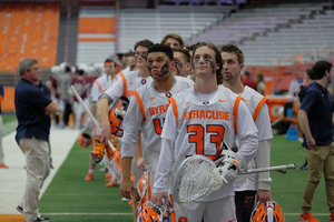 Gettysburg College transfer Mitch Wykoff joins a Syracuse defense that lost Nick Mellen, but returns goalie Drake Porter (33).