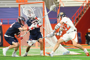 Chase Scanlan takes a backhanded shot in Syracuse's 17-9 win over Stony Brook.