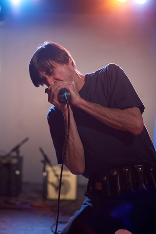 Mike Petroff, a Syracuse native, wails on the harmonica during various blues songs at the event.