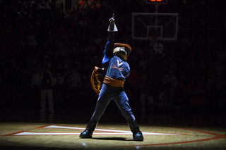 The Virginia mascot invigorates the sold-out crowd in a spotlight prior to the game. 