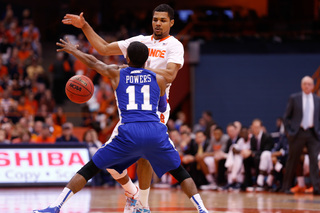 SU forward Michael Gbinije dribbles against Hampton's Deron Powers.