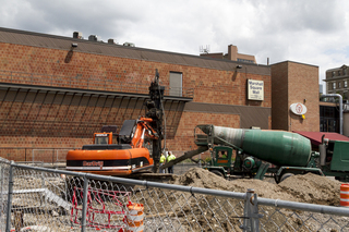 Construction workers prepare to pour concrete in portions of the structure that is soon to be additional student housing. Photo taken July 11, 2017