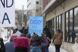 People carried signs with feminist messages regarding gender, privilege and education, among other areas of social justice.