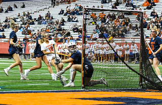 Meghan Tyrrell watches her shot hit the back of the net.